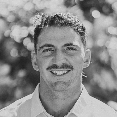 Black‑and‑white close‑up portrait of a person outdoors